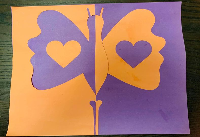 Purple and yellow butterfly art with hearts