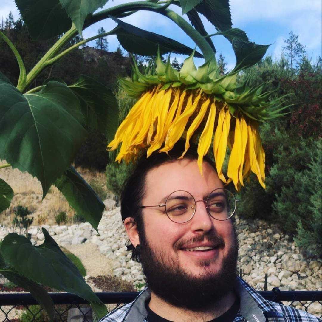 Daniel Klayton with a sunflower on his head